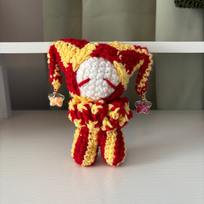 Handmade Crochet Jester Plushie – Whimsical Amigurumi Clown Doll in Red and Yellow with Star Charms