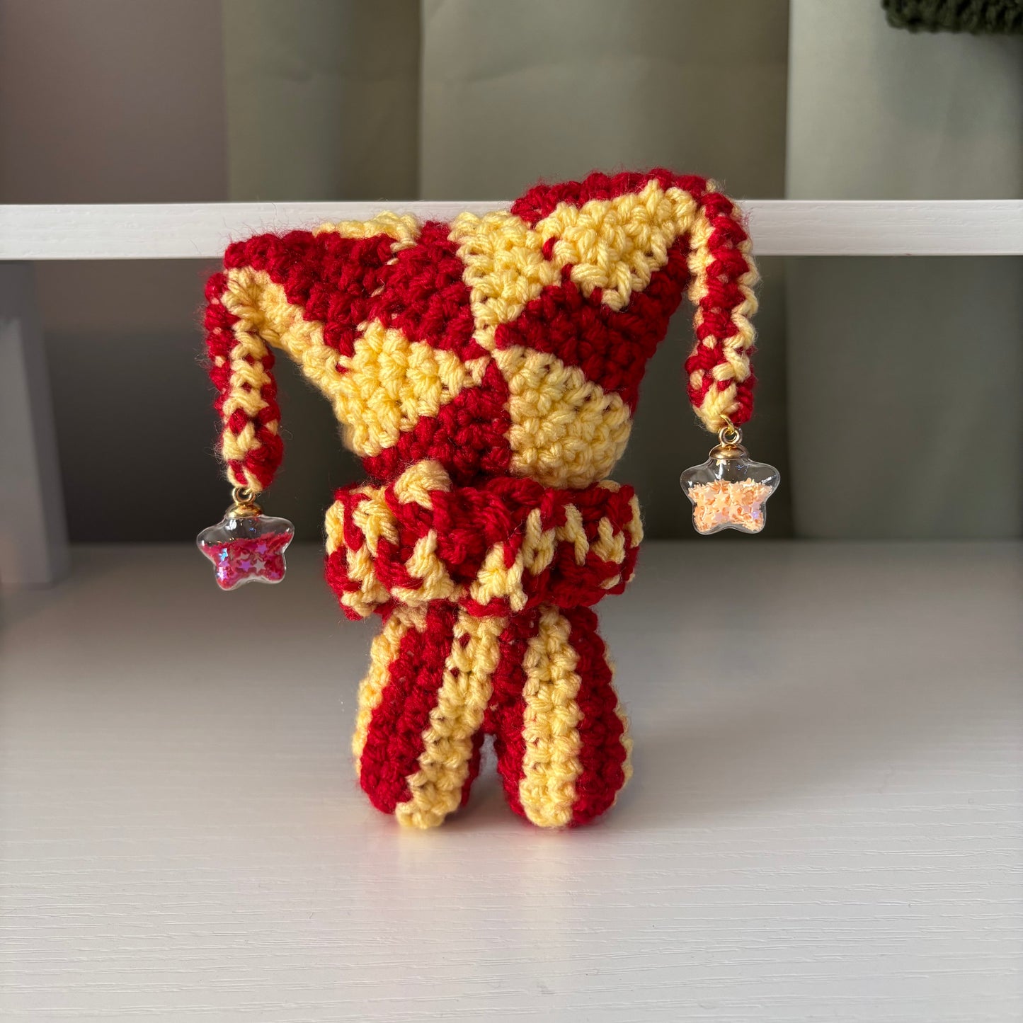 Handmade Crochet Jester Plushie – Whimsical Amigurumi Clown Doll in Red and Yellow with Star Charms