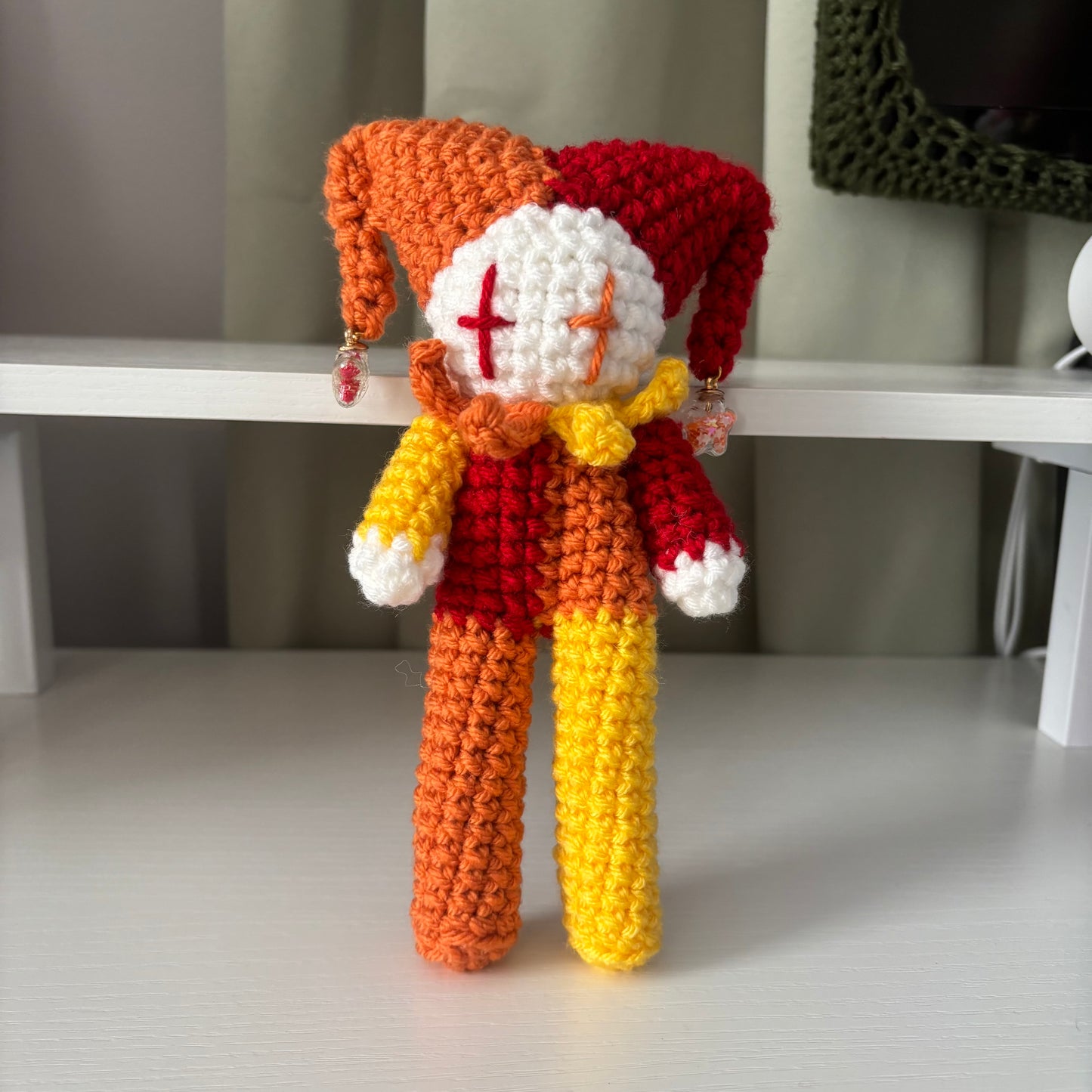 Handmade Crochet Tall Jester Plushie – Amigurumi Clown Doll in White and Red, Orange, and Yellow