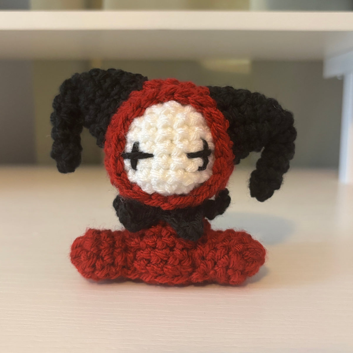 Handmade Crochet Mini Sitting Jester Plushie – Amigurumi Clown Doll in Black and Red