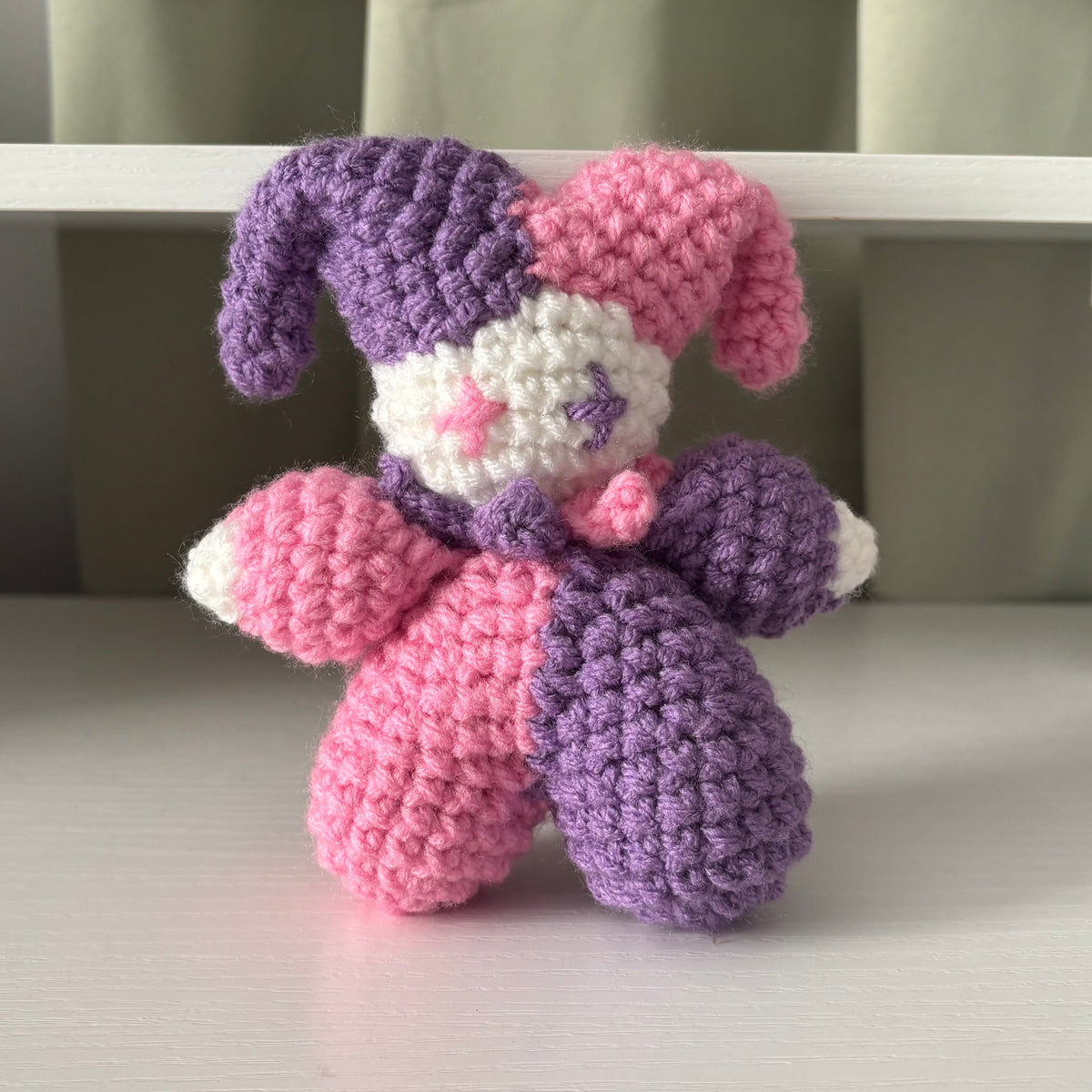 Handmade Crochet Jester Plushie – Whimsical Amigurumi Clown Doll in Purple and Pink