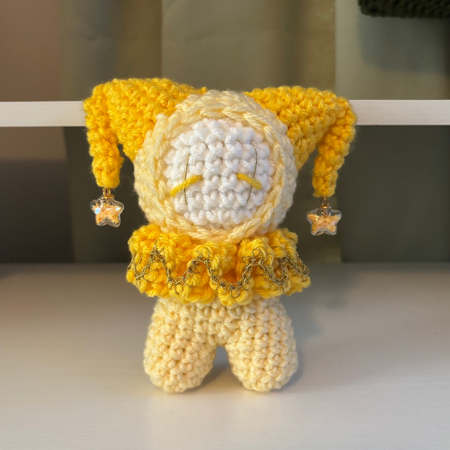 Handmade Crochet Jester Plushie – Whimsical Amigurumi Clown Doll in Yellow with Star Charms