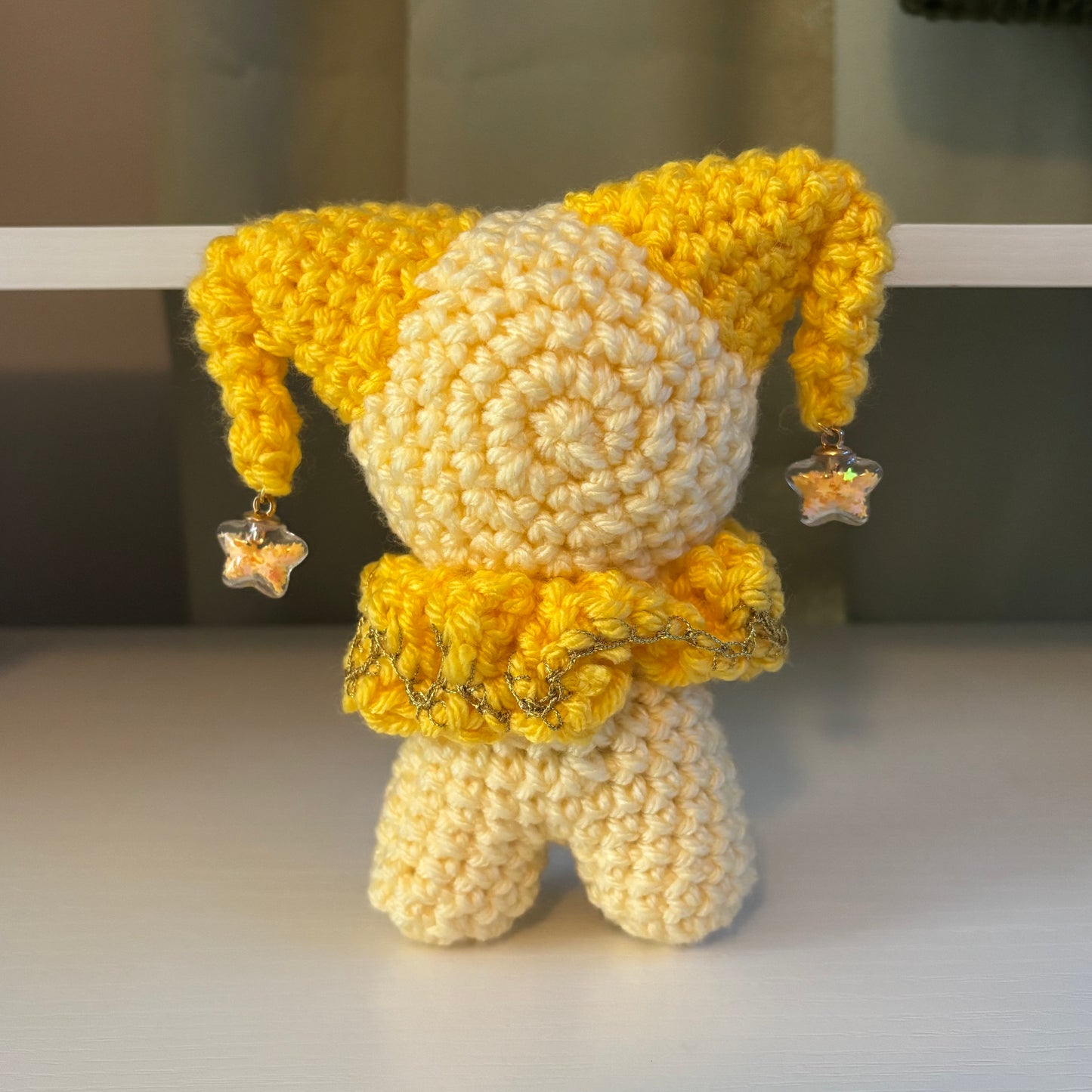 Handmade Crochet Jester Plushie – Whimsical Amigurumi Clown Doll in Yellow with Star Charms